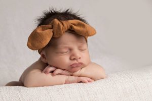 Newborn Wearing Rust Coloured Headband Newborn Photography Melbourne