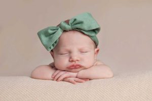 Newborn Girl wearing a Green Headband Newborn Photography Melbourne