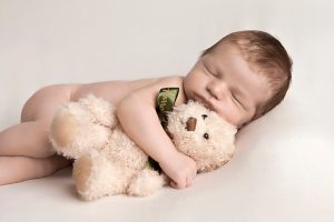 newborn and toy