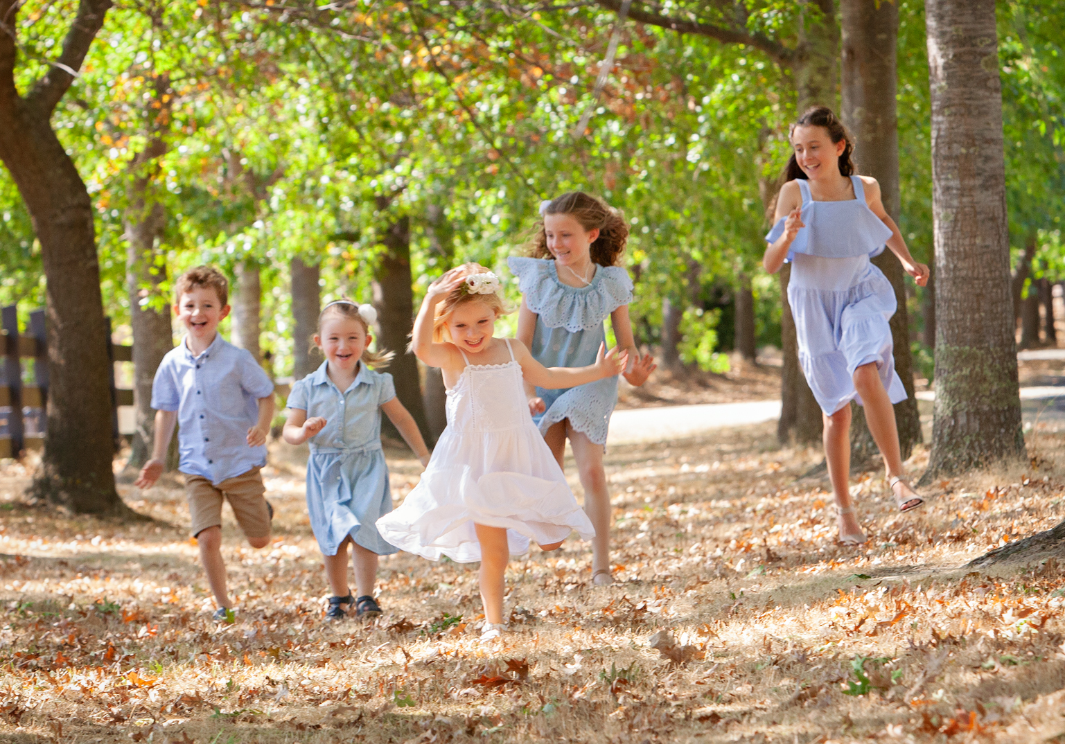 Kids Running in Autumn Leaves