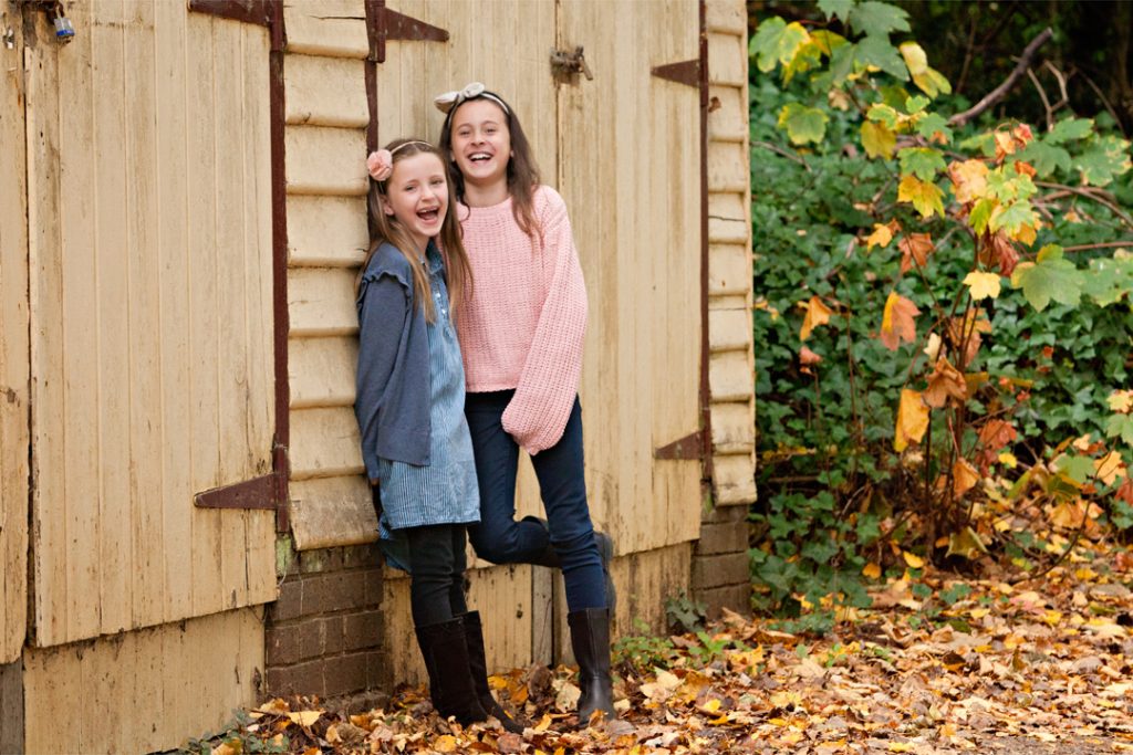 two girls laughing near building Macedon Ranges