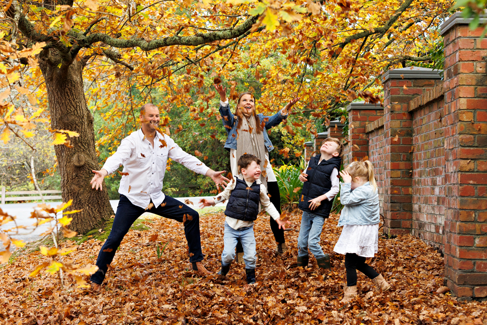 family in Autumn leaves Mount Macedon